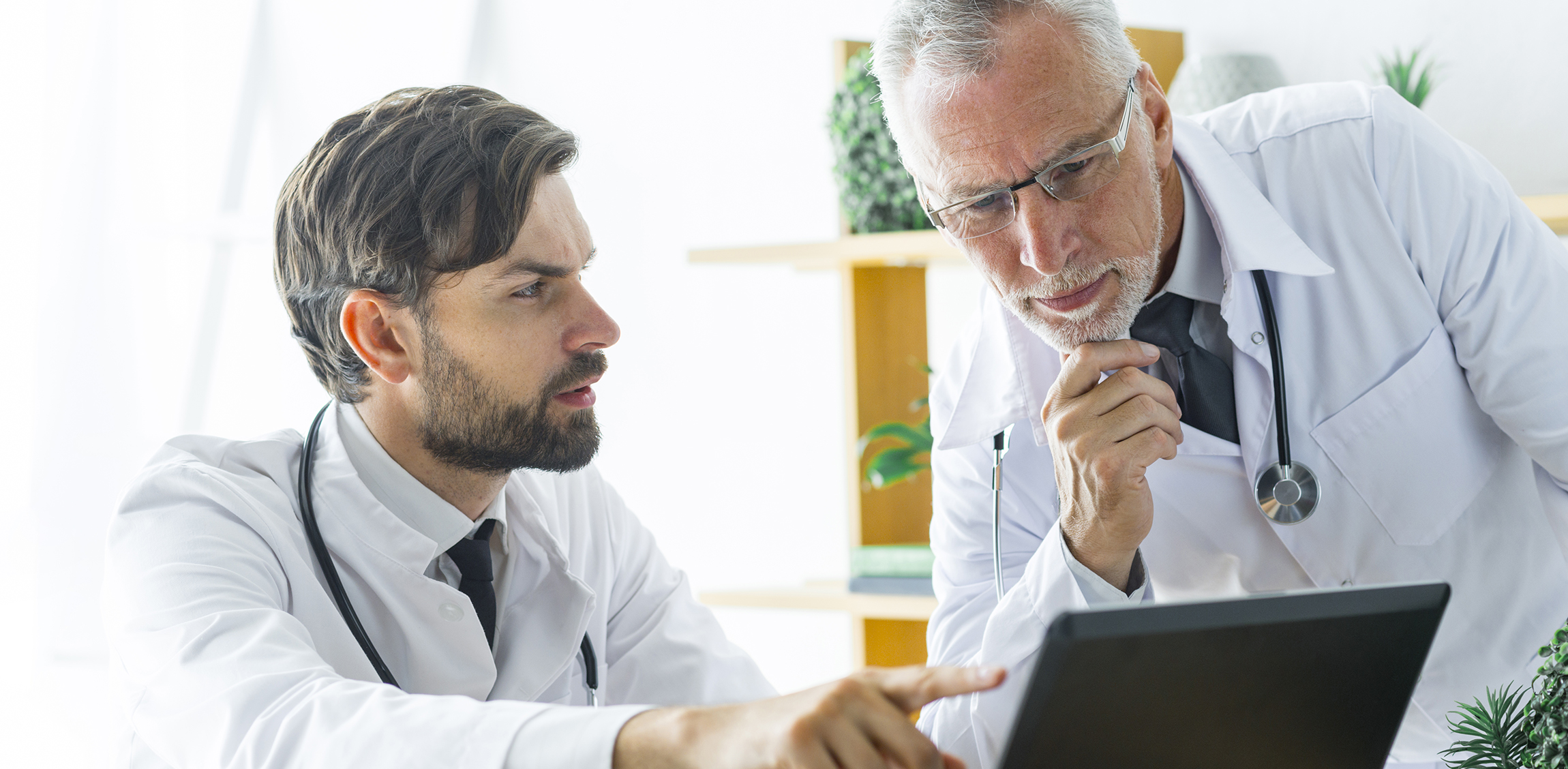 young-doctor-consulting-with-senior-colleague